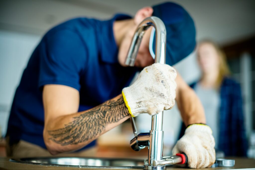 plumber-fixing-kitchen-sink